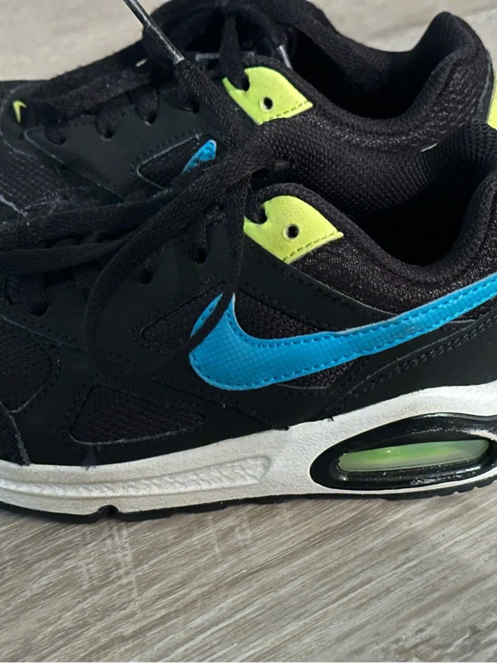 Nike Kids Black Sneakers with Blue Swoosh and Neon Yellow Accents